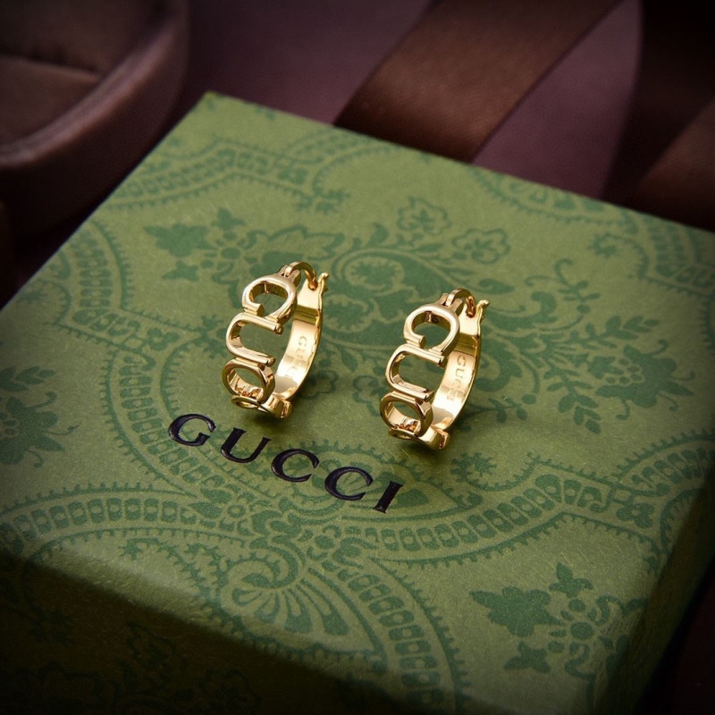 G*u*i earrings